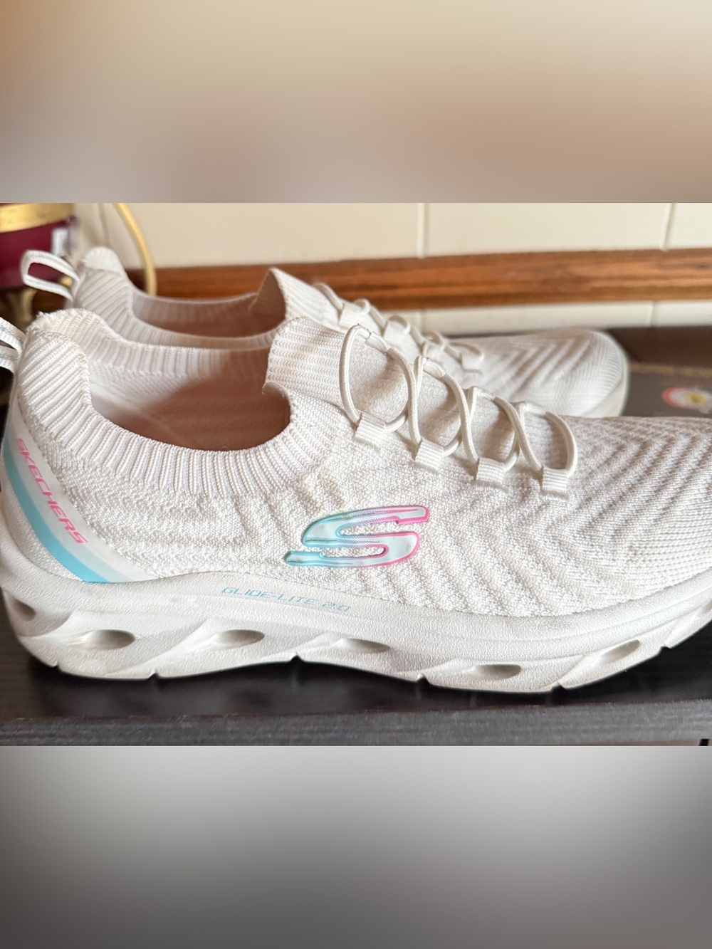 Skechers Women's White Slip-On Knit Sneaker with Pastel Pink & Blue Logo